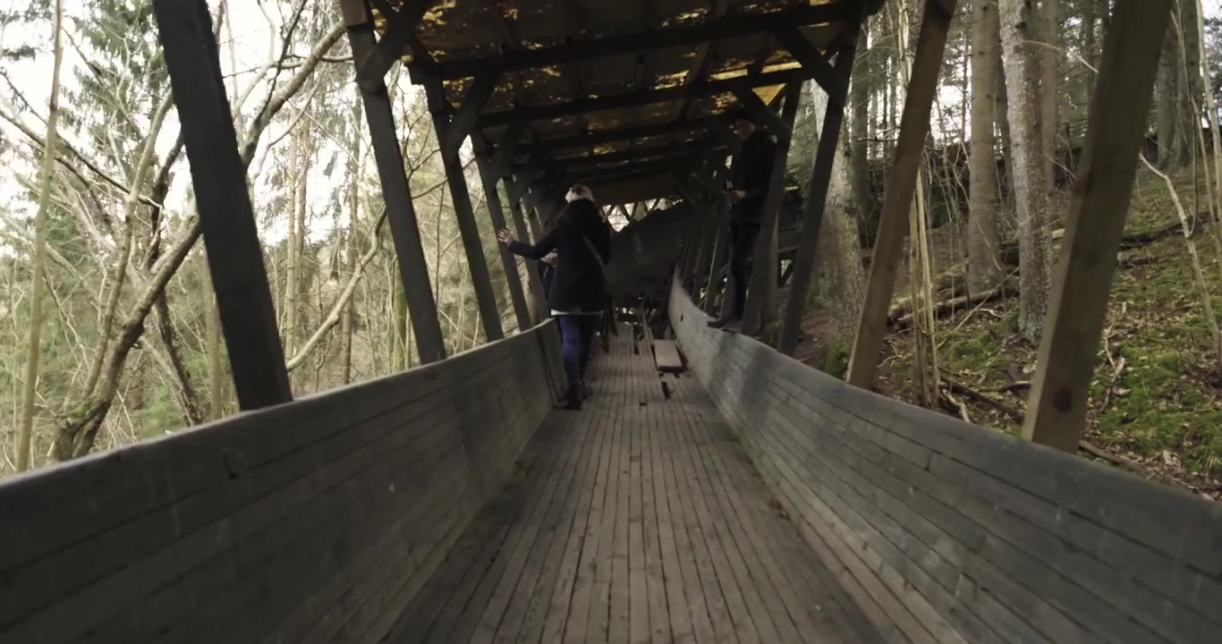Tourists Explore A Old Bobsleigh Or Luge Course In Gauja, Latvia.