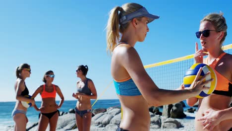 female volleyball coach interacting with female player 4k