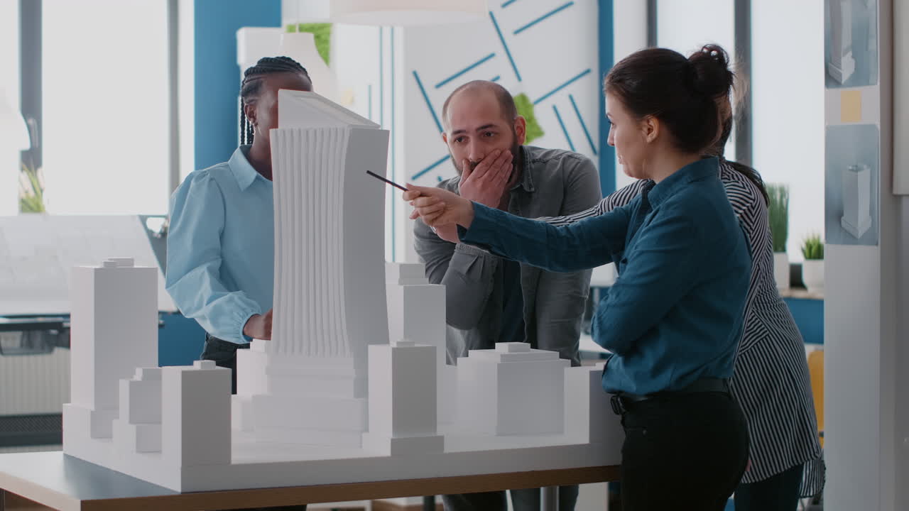Architects Collaborating on Skyscraper Model