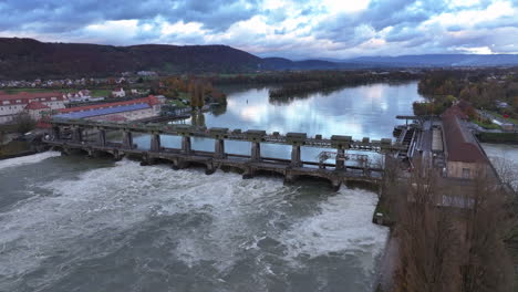 hydroelectric power plant augst by high water level of rhine river, drone pan 4k