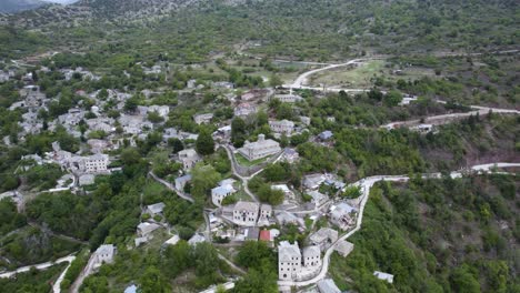 aerial point of interest shot of tzoumerka mountain village kalarites in epirus greece, traditional stone made houses view