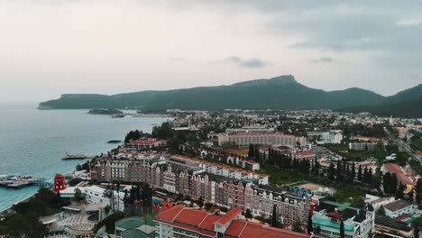 Drone-View-of-Kemer-City-of-Antalya,-Resort-Town-on-Mediterranean-Coast-of-Turkey