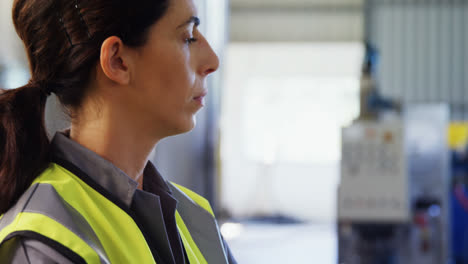 Worker-standing-with-arms-crossed