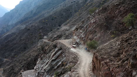 Car-driving-on-dangerous-mountain-road-to-Fairy-Meadows,-Pakistan