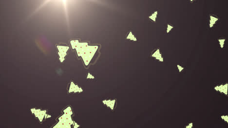 multiple christmas tree icons falling against spot of light on grey background