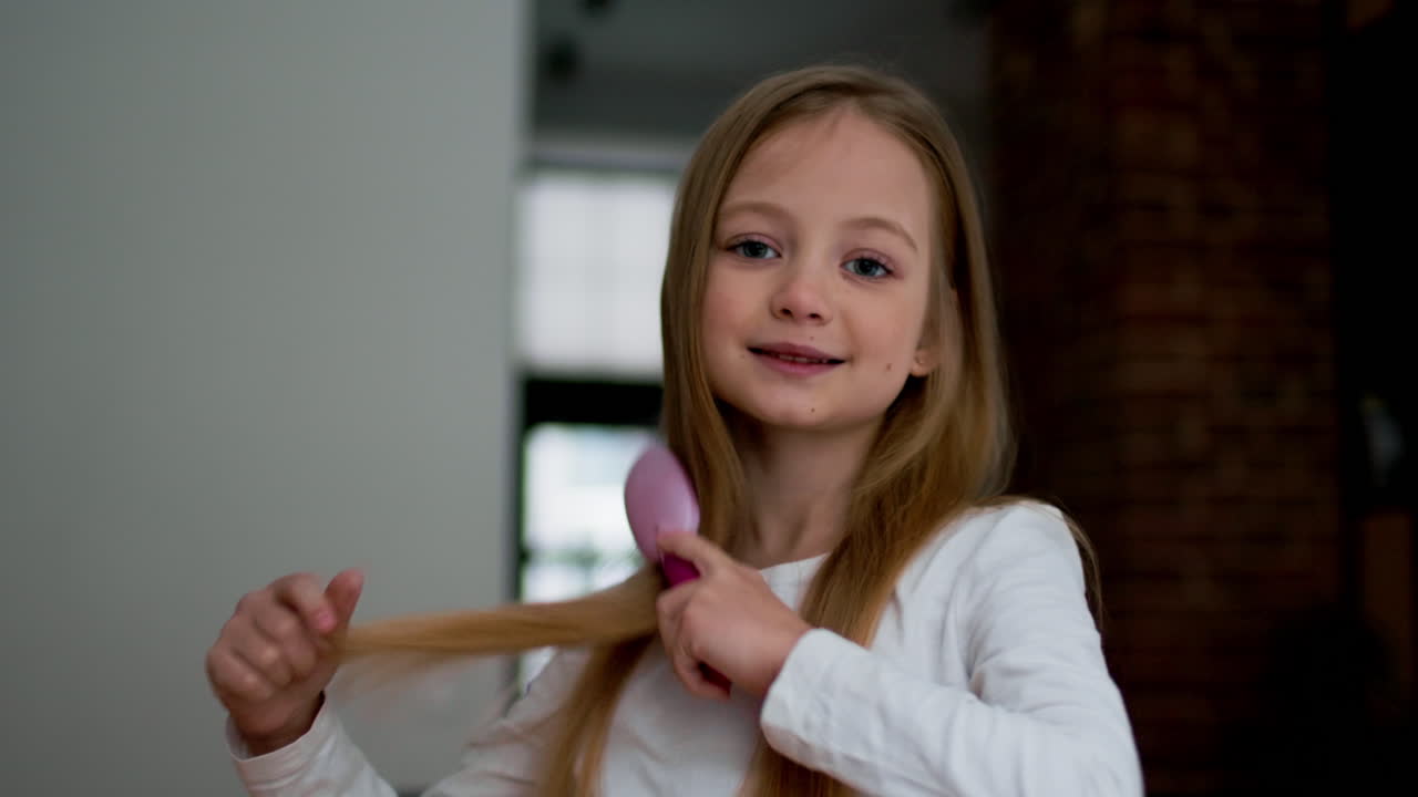 Girl brushing her long hair