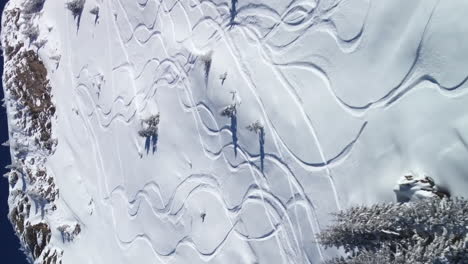 vertical flyover above fresh ski tracks, avoriaz ski resort in french alps