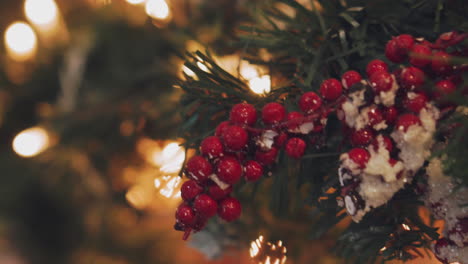 hanging christmas decoration on tree with christmas lights. decorating on christmas tree with ball.