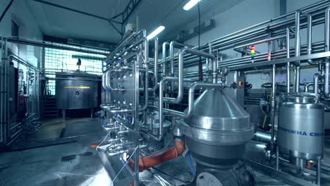 dairy plant premise with fully automatic equipment. stainless steel installation for the processing milk and producing dairy products.