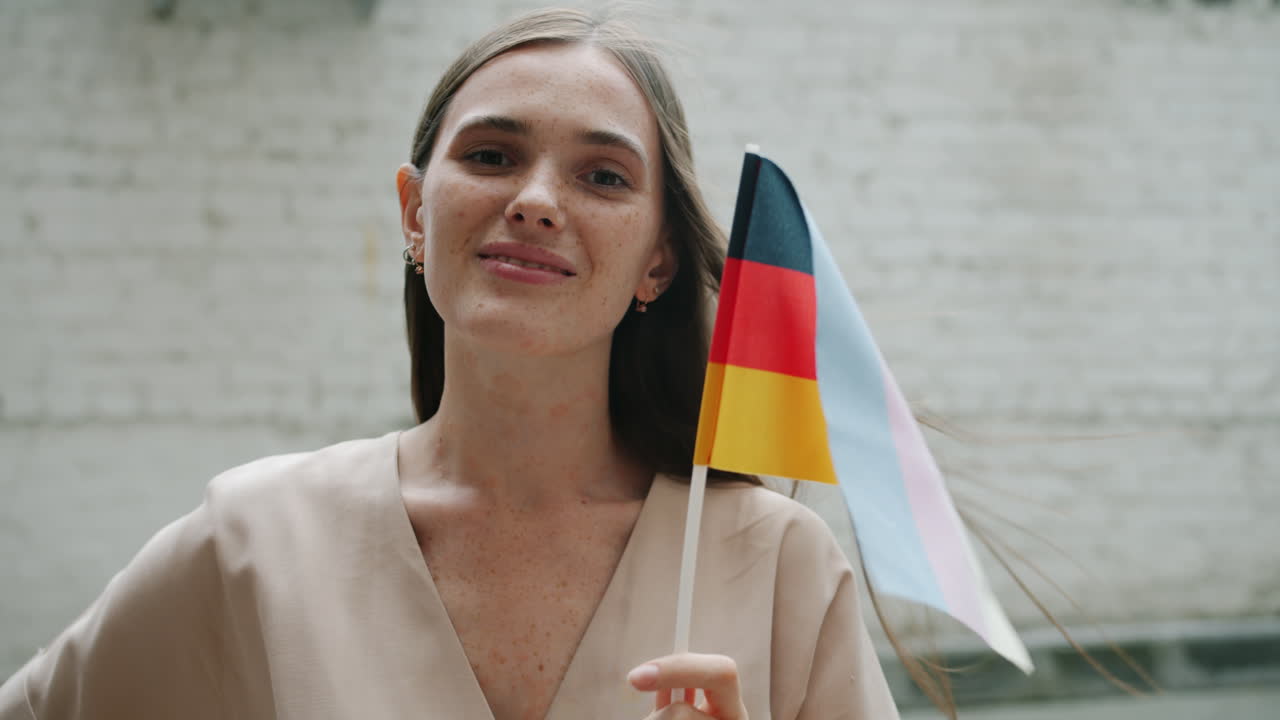 Woman holding German flag