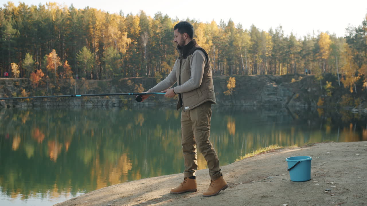 Man Fishing in Autumn Forest