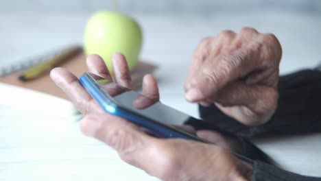 elderly person using a smartphone