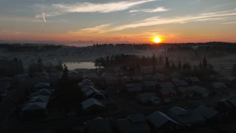 establishing aerial view of a frosted over neighborhood on a cold winter morning