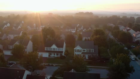 Aerial-of-suburban-homes-in-USA-at-foggy-sunrise
