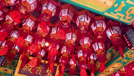 colorful lanterns hanging in a temple setting