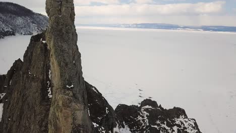 frozen mountain peak over a glacier lake