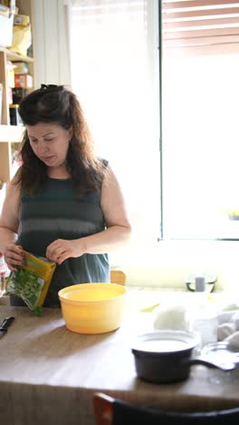 woman preparing food in kitchen