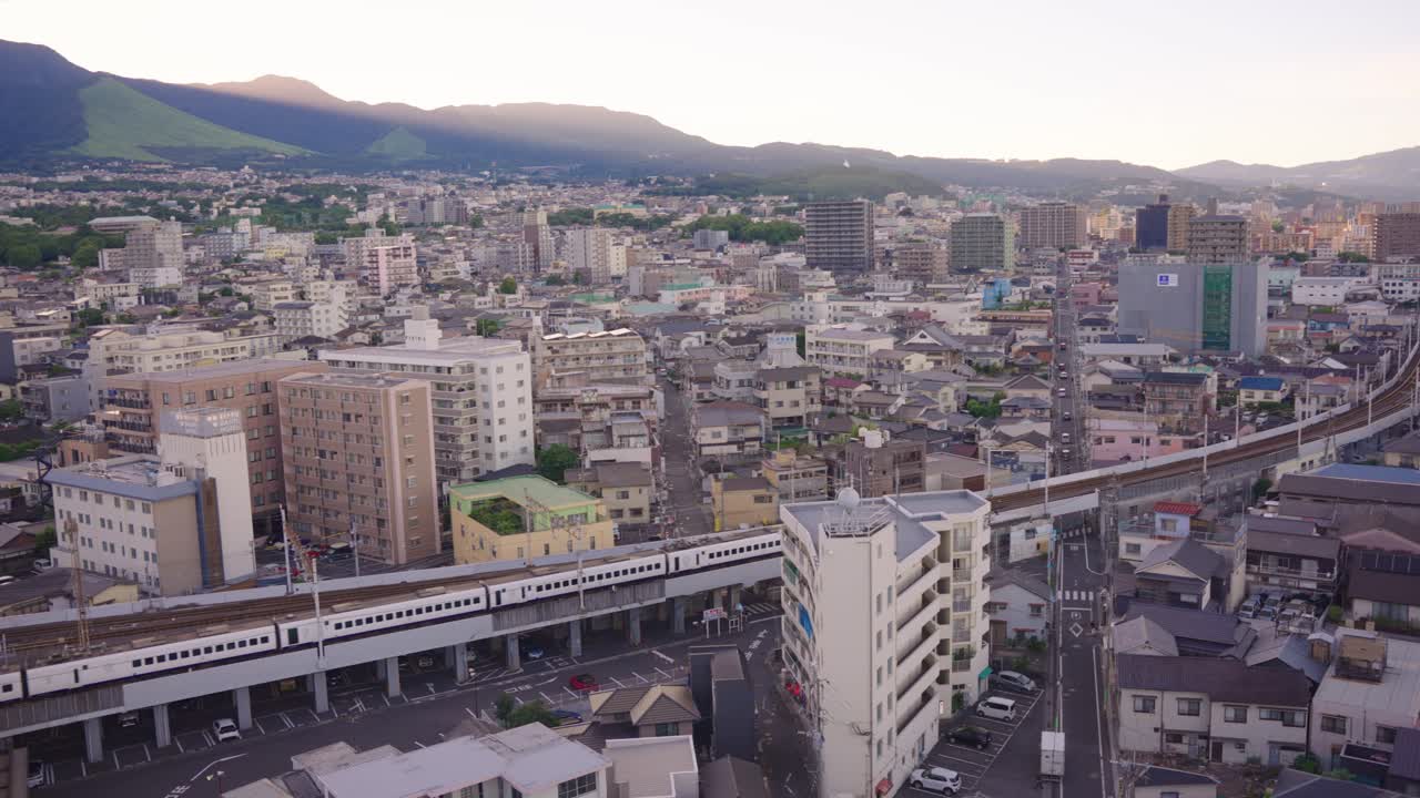 Cityscape with Train and Mountains