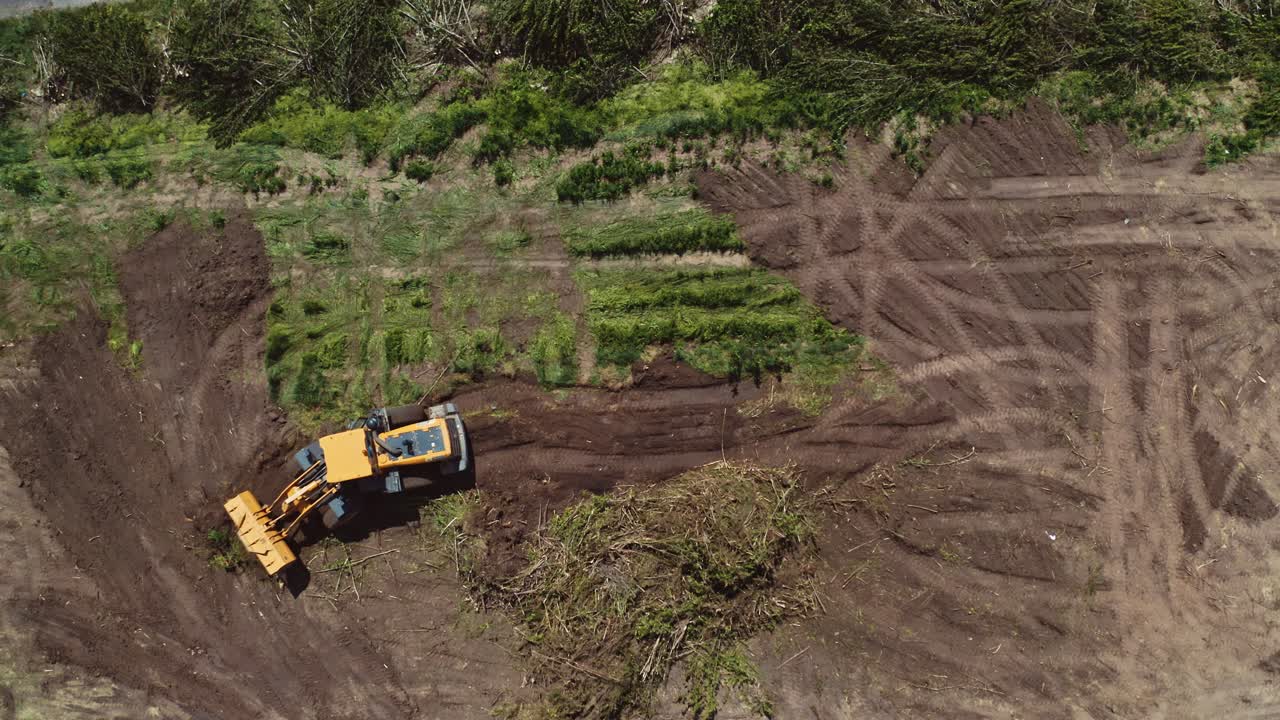 Bulldozer working on field. Top down view of excavator machine on field