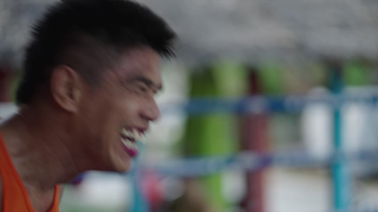 Close-up of a Male Athlete's Intense Expression During Training