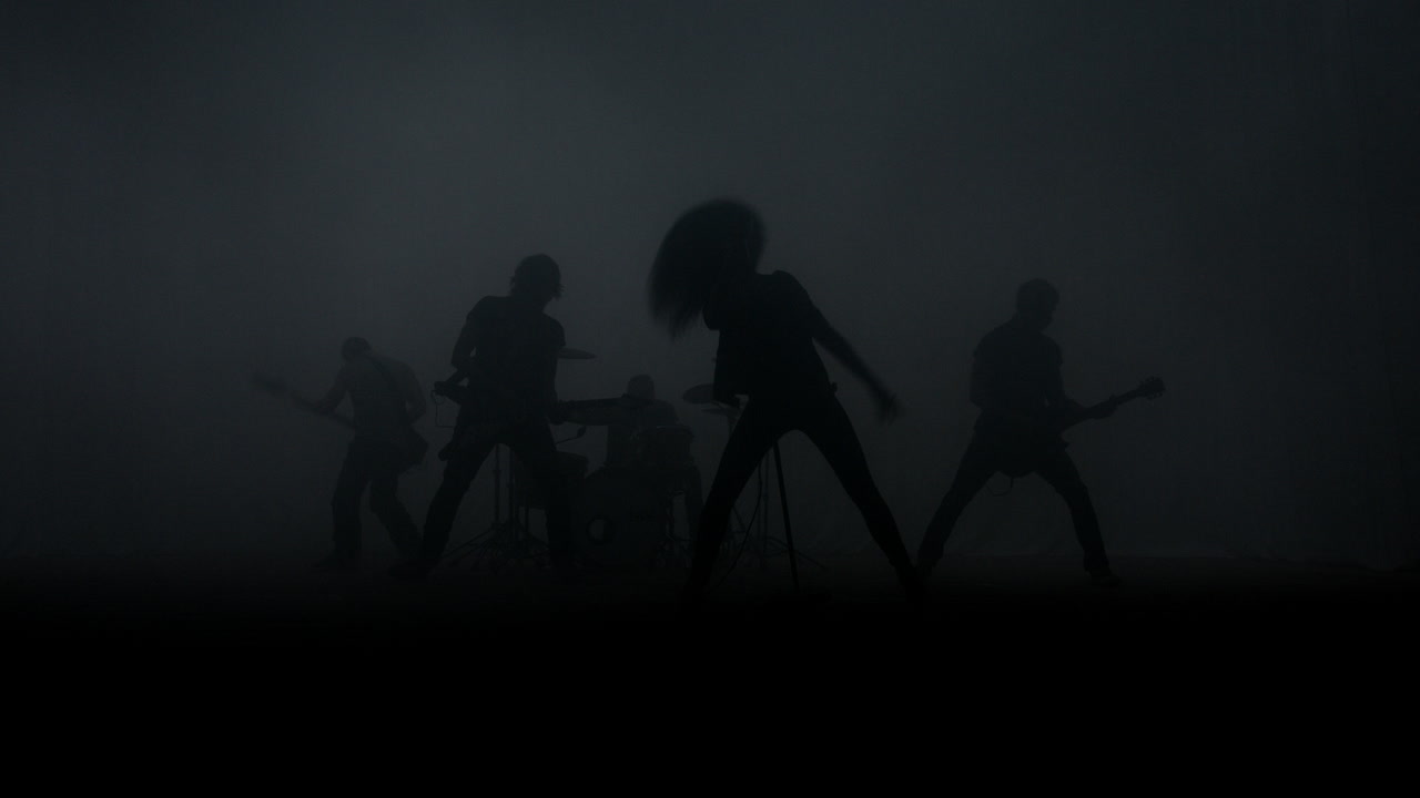 Rock music concert. Rock group silhouette performing on music concert