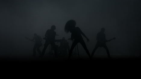 rock music concert. rock group silhouette performing on music concert