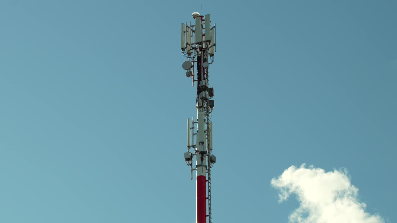 Transmission tower, with antennas. Communication infrastructure outdoors with blue sky