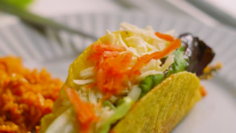 delicious fresh mexican tacos made from crispy corn tortilla filled with variety of ingredients including beef, lettuce, carrot, tomatoes and cheese. fresh food originally from mexico