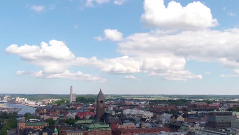 downtown and church tower of norrkoping in aerial tilt down view