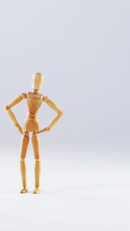 figurine standing with hands on hip