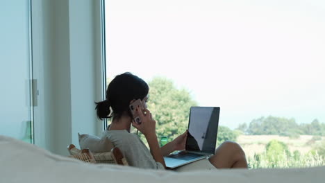 freelancer's day: working and chatting by the window