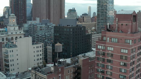 Aerial-footage-of-various-buildings-in-urban-neighbourhood.-Rectangular-street-network-with-apartment-buildings.-Manhattan,-New-York-City,-USA