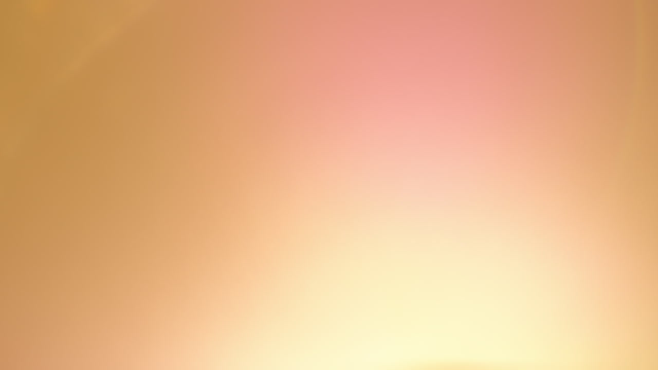 Warm light effect in studio over black background