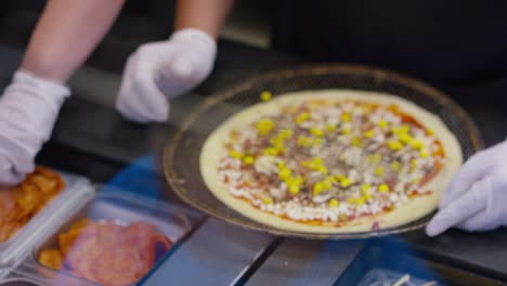 making pizza in the kitchen at the restaurant for lunch with the pres