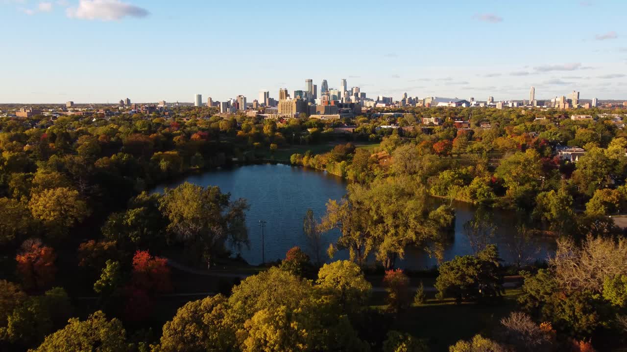 Drone over Powderhorn Park Minneapolis looking towards skyline