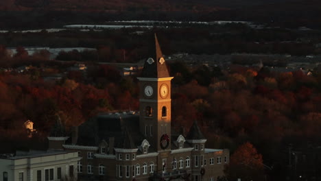 christmas wreath on clock tower of historic washington county courthouse at sunrise in autumn