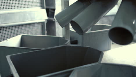 seeds fall from conveyor into boxes after cleaning process. industrial workshop