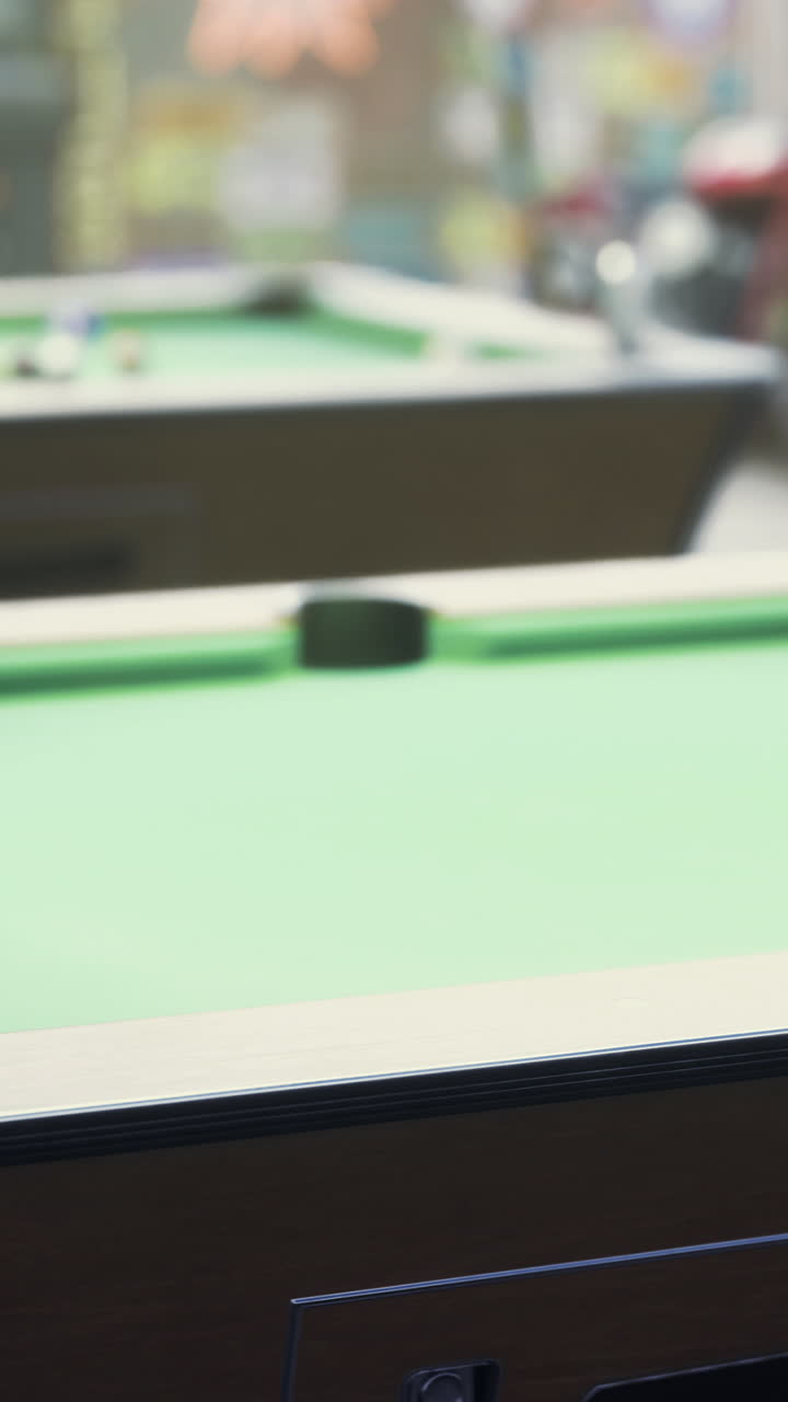 Exciting moments at a bustling billiards hall in the evening