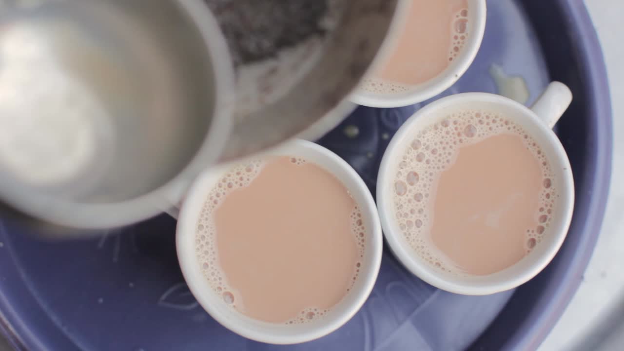 The Making Of Spiced Chai Tea In A Traditional Village.