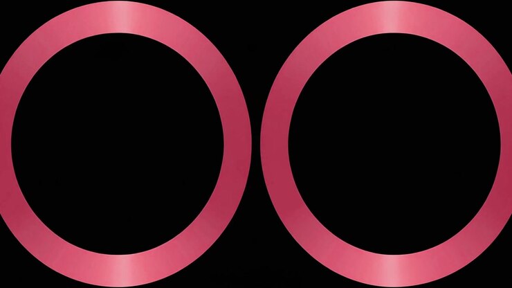 Due anelli metallici rosa che si espandono e si contraggono su sfondo nero