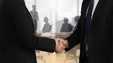 Animation-of-businessman-and-businesswoman-shaking-hands-over-businesspeople-in-office