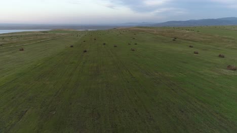 aerial view of a field with hay bales