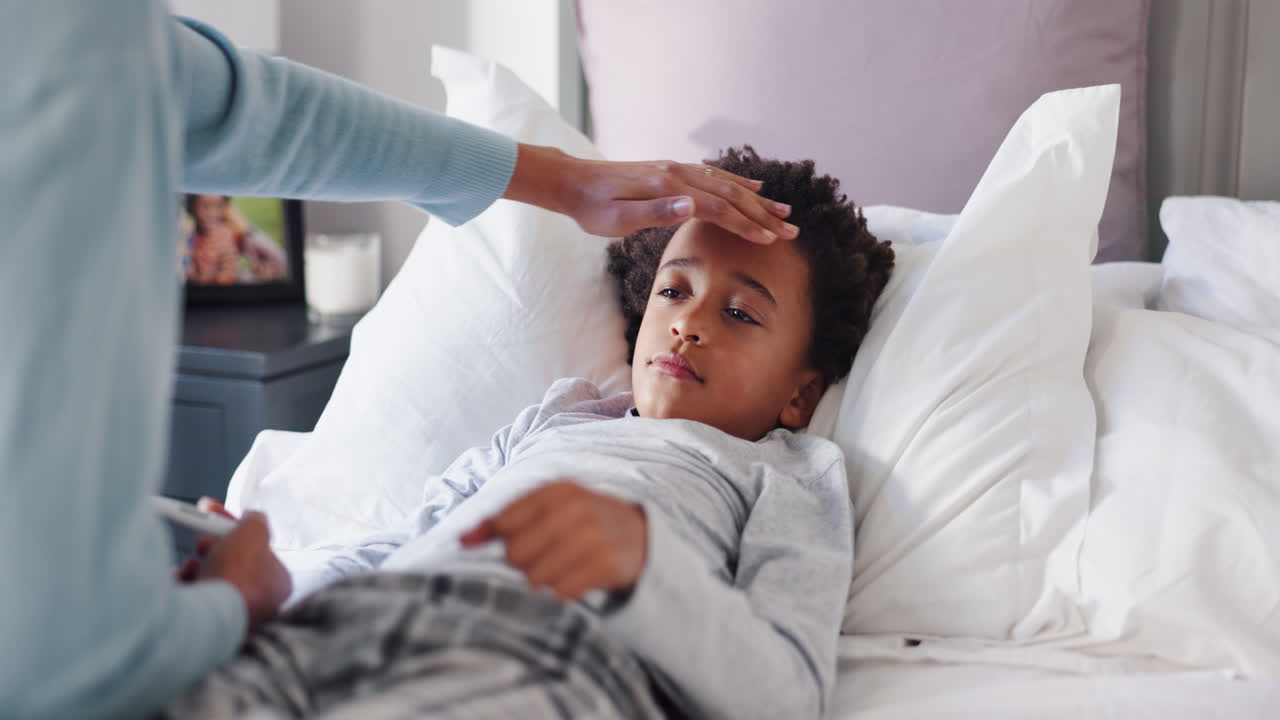 Mother Checks Sick Child's Temperature