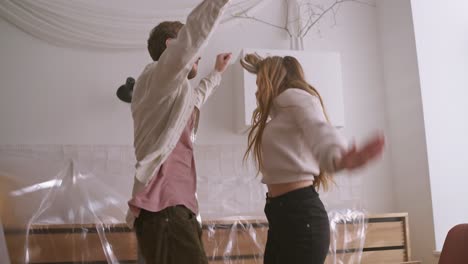 couple dancing in newly renovated kitchen