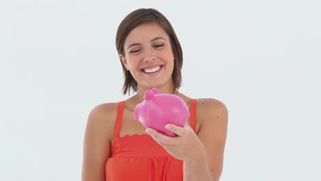 Girl-makes-a-deposit-in-her-piggy-bank