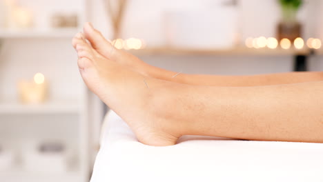 feet, acupuncture and therapy with a woman