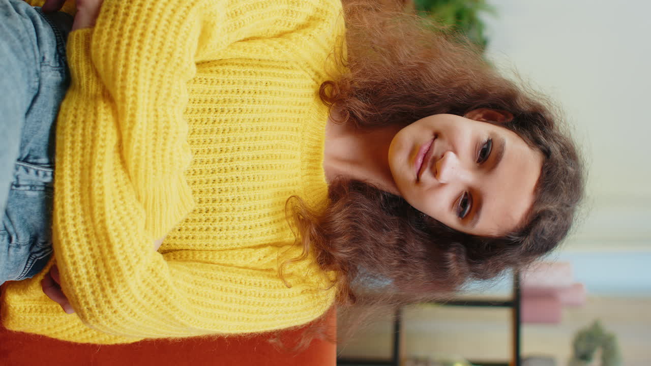 Portrait of happy smiling caucasian 15 years school girl child kid looking at camera home play room