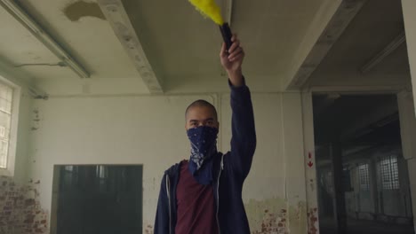 fashionable young man in an abandoned warehouse