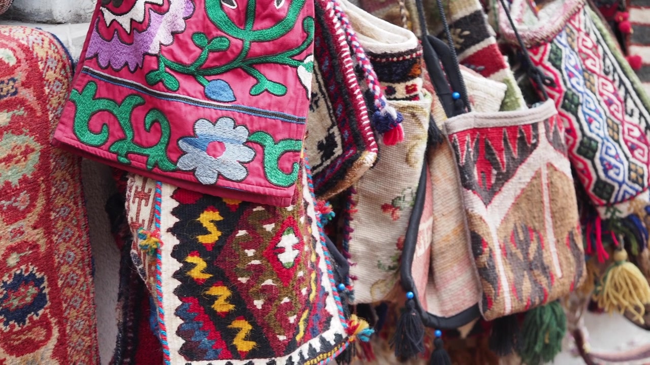 Colorful Handmade Bags and Embroidered Textiles on Display