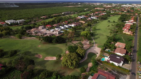 aerial flying over cocotal golf and country club and villas